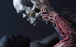 A sculpture of a human with a skeleton on it.